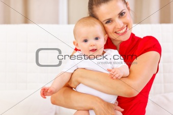 Portrait of cute baby and happy young mother