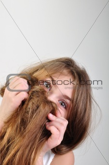 girl hiding behind her hair