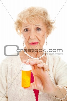 Sad Senior Woman with Pills