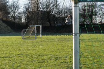 Two empty soccer goals