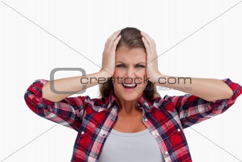 Irritated woman with the hands on her head