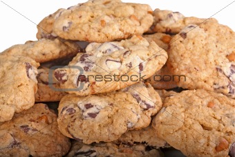 Mound of chocolate chip cookies against a white background
