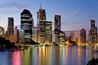 Brisbane city reflected in the river at sunset