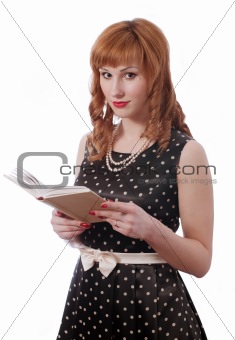 Retro girl with the book in the hands