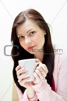 Woman enjoy drink with a cup