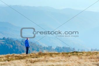 Small girl on autumn  mountain plateau 