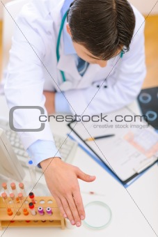 Medical doctor spreading hand for handshake. Top view