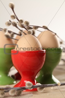 Eggs in red and green eggcups