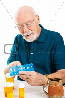 Senior Man Sorting Pills