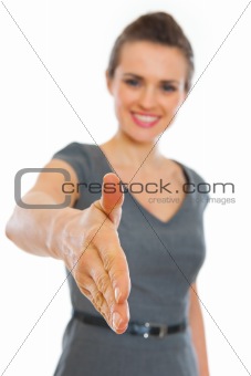 Business woman stretching hand for handshake