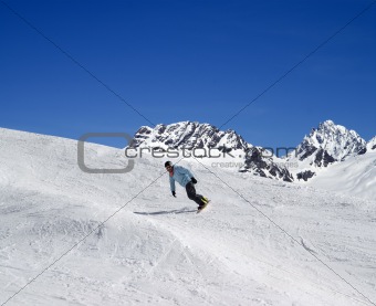 Snowboarding in high mountains