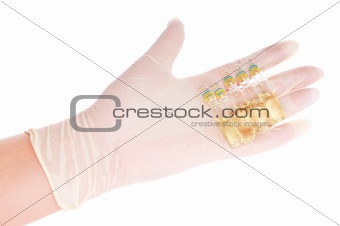 Hand with ampules on white