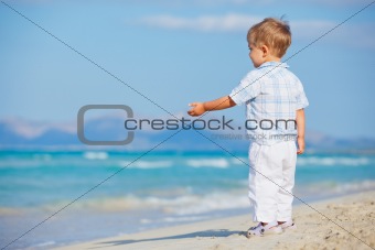 Little cute boy on the beach
