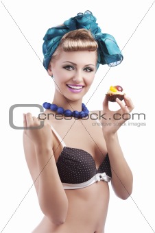 blond young girl holding pastry