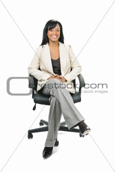 Black businesswoman sitting in office chair