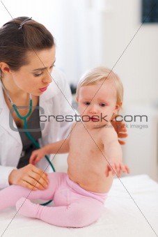 Pediatric doctor calming crying baby
