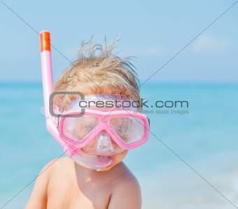 A cute little boy wearing a mask for diving