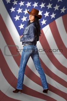 Young woman in jeans with American flag