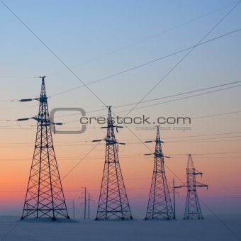 Electrical mast at morning snow