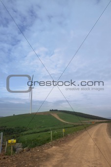 dirt road to a windmill in tipperary countryside