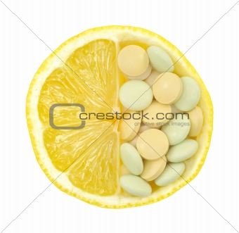 Close up of lemon and pills isolated