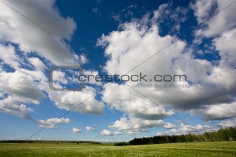 Landscape of countryside with blue cloudy sky