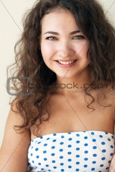 Portrait of a cute brunette with beautiful curls