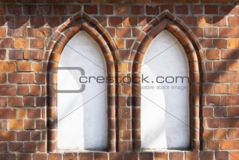 gothic wall decorations in the shade of trees surrounding 