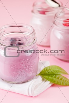 Yogurt on rose background