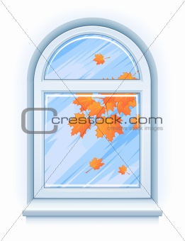 Window with yellow autumn leaves and rainy weather