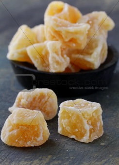 candied ginger on a dark background