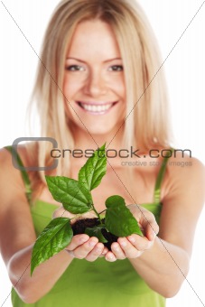 plant in blonde hands