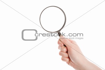 Hand holding magnifying glass 