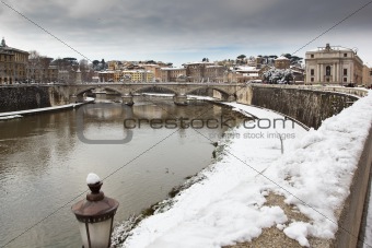 Snowy shore of the Tiber river, Rome (Italy).