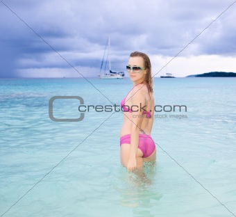 Beautiful model posing on the ocean