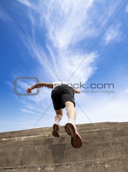 Man running up stairs