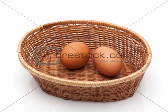 two eggs in wicker basket
