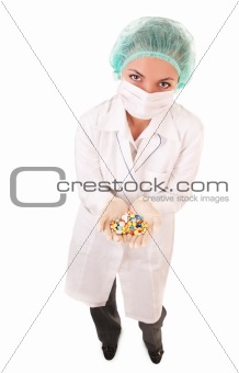 Serious doctor with pills