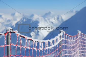 Hoarfrost on protective net in mountains