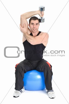 Young man doing Seated Dumbbell One Arm Triceps Extensions on Fitnes Ball, phase 1 of 2.