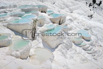 Blue water travertine pools at Pamukkale, Turkey 
