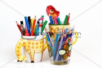 pen holders  with colored pens on a white background 