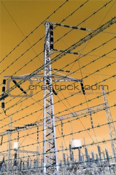 high voltage post at sunset