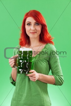 Beautiful female drinking green beer