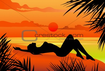 Girl lying on the beach silohuette