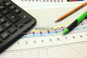 Calculator, graph, pencil and pen