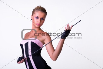 Female model posing in black and pink dress