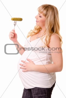 Pregnant woman with preserved cucumber