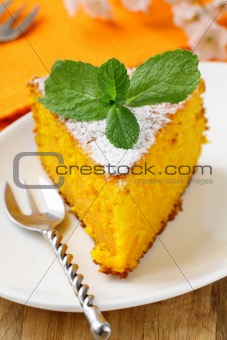 Carrot cake with powdered sugar and mint