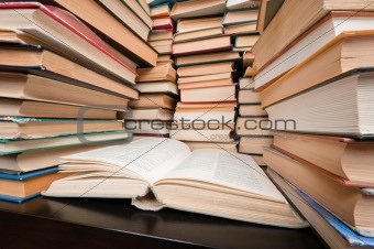 Stacks of books on black table